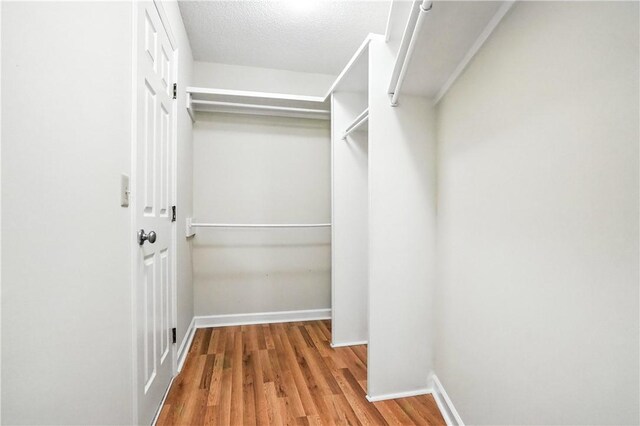 310 Peachtree St, Saint Simons Island, GA 31522 - spacious closet featuring wood finished floors