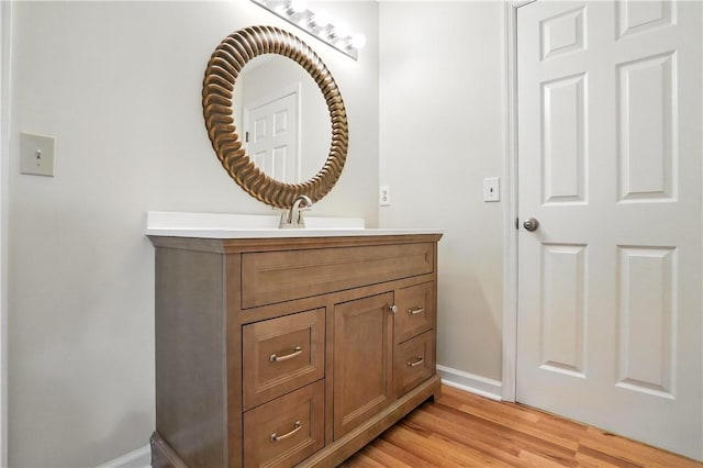 310 Peachtree St, Saint Simons Island, GA 31522 - bathroom with vanity and wood finished floors
