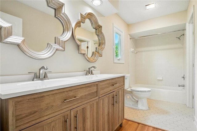 310 Peachtree St, Saint Simons Island, GA 31522 - bathroom featuring double vanity, tub / shower combination, and wood finished floors
