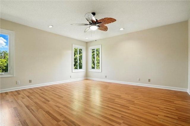 310 Peachtree St, Saint Simons Island, GA 31522 - spare room featuring light wood-style floors, ceiling fan, and recessed lighting