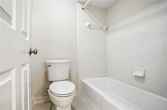 310 Peachtree St, Saint Simons Island, GA 31522 - full bath with tile patterned floors and bathtub / shower combination