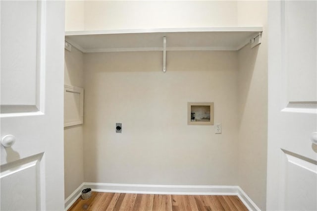 310 Peachtree St, Saint Simons Island, GA 31522 - washroom featuring washer hookup, electric dryer hookup, and light wood-type flooring