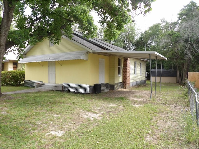 view of property exterior featuring a yard