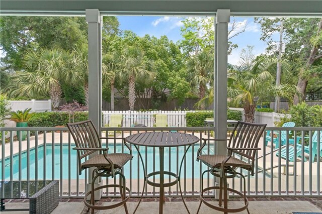 1073 Demere Rd, Saint Simons Island, GA 31522 - sunroom / solarium featuring view of scattered trees