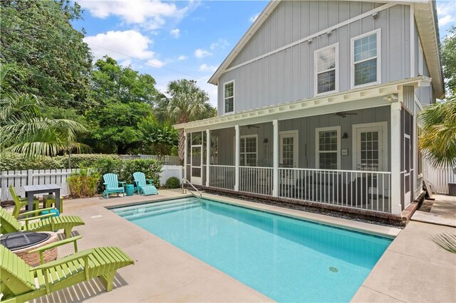 1073 Demere Rd, Saint Simons Island, GA 31522 - back of house with board and batten siding, a patio, fence, and ceiling fan