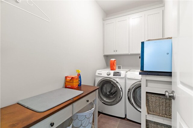 1073 Demere Rd, Saint Simons Island, GA 31522 - laundry area with cabinet space, washing machine and clothes dryer, and light tile patterned flooring