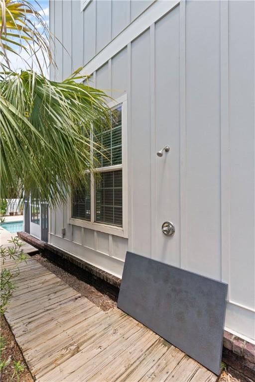 1073 Demere Rd, Saint Simons Island, GA 31522 - doorway to property featuring board and batten siding