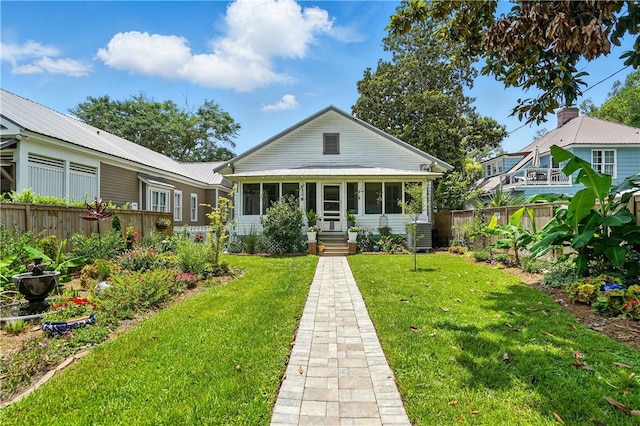 604 Union St, Brunswick, GA 31520 - bungalow-style home featuring a fenced backyard and a metal roof