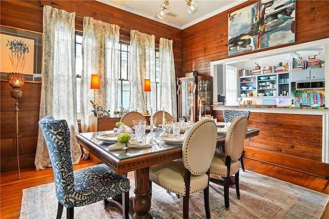 604 Union St, Brunswick, GA 31520 - dining room with ornamental molding, wood finished floors, and wood walls