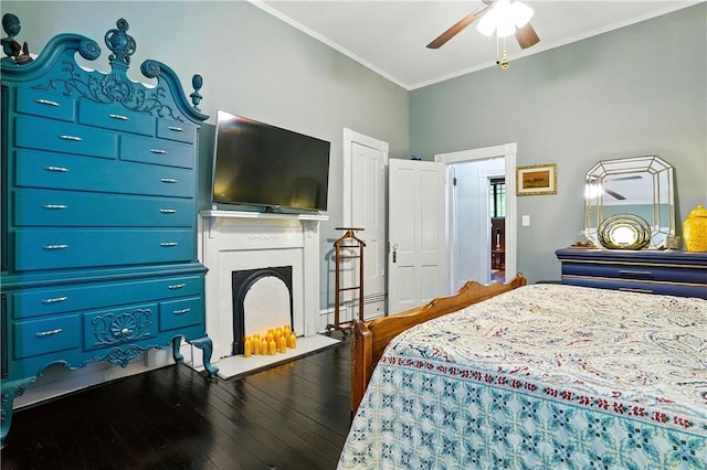 604 Union St, Brunswick, GA 31520 - bedroom with crown molding, wood finished floors, ceiling fan, and a fireplace