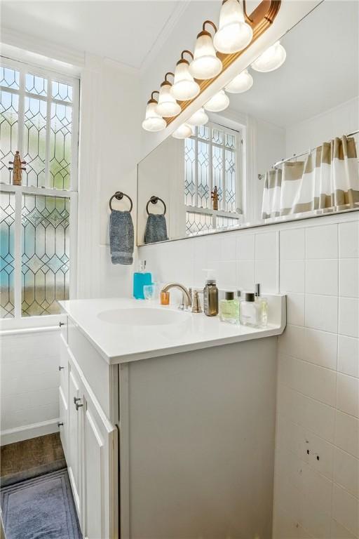604 Union St, Brunswick, GA 31520 - bathroom featuring vanity and ornamental molding