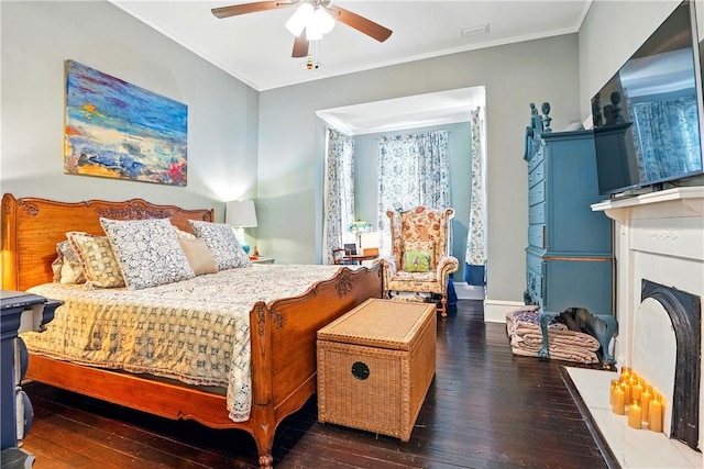 604 Union St, Brunswick, GA 31520 - bedroom with hardwood / wood-style floors, crown molding, a ceiling fan, and a fireplace with flush hearth