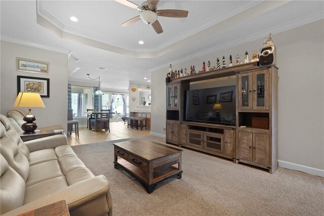 199 Austin Ryan Dr, Kingsland, GA 31548 - living area featuring crown molding, a ceiling fan, recessed lighting, a tray ceiling, and baseboards
