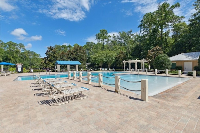 view of pool featuring a patio area and a pergola