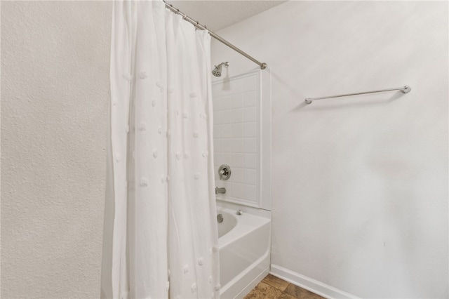 bathroom with shower / bathtub combination with curtain