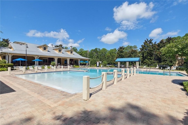 view of swimming pool featuring a patio