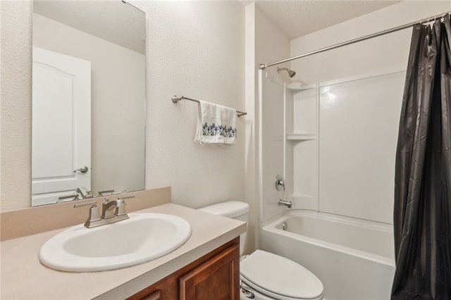 full bathroom featuring shower / tub combo, vanity, a textured ceiling, and toilet