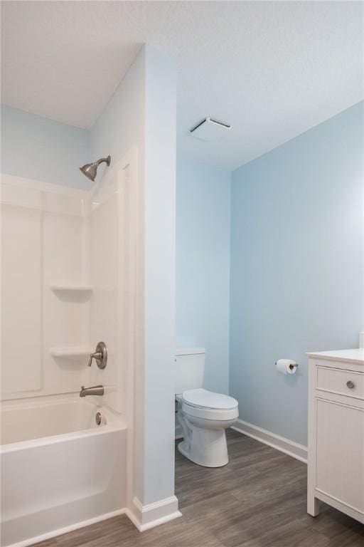 3 Dixon Ln, Blackshear, GA 31516 - bathroom with toilet, vanity, wood finished floors, shower / bathtub combination, and baseboards