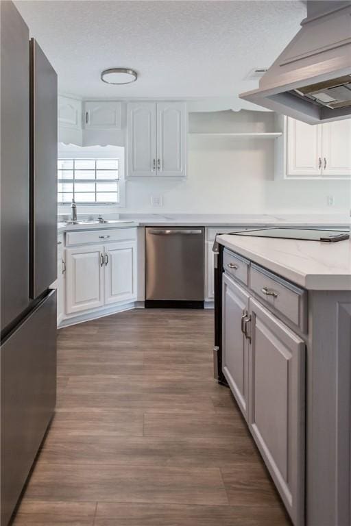 3 Dixon Ln, Blackshear, GA 31516 - kitchen featuring stainless steel appliances, white cabinets, premium range hood, wood finished floors, and open shelves