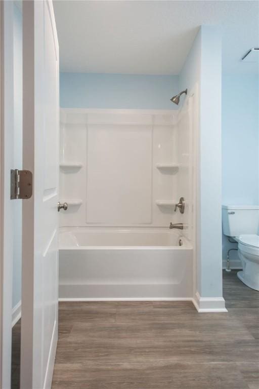 3 Dixon Ln, Blackshear, GA 31516 - bathroom with toilet, baseboards, wood finished floors, and bathtub / shower combination
