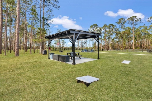 view of property's community with a gazebo and a lawn