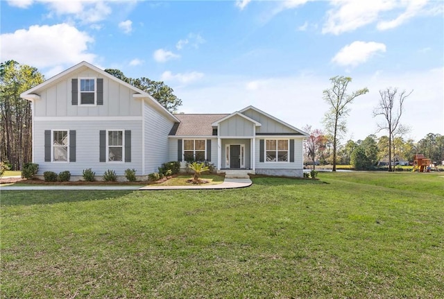 view of front of home featuring a front yard and board and batten siding