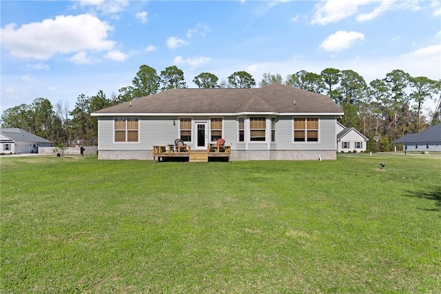 back of property featuring a yard and a deck