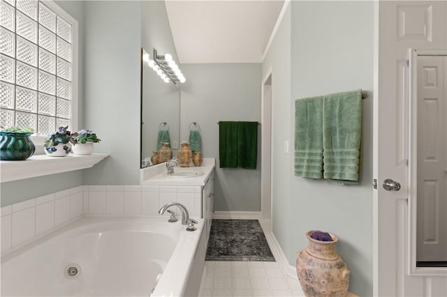 bathroom featuring a bath and vanity