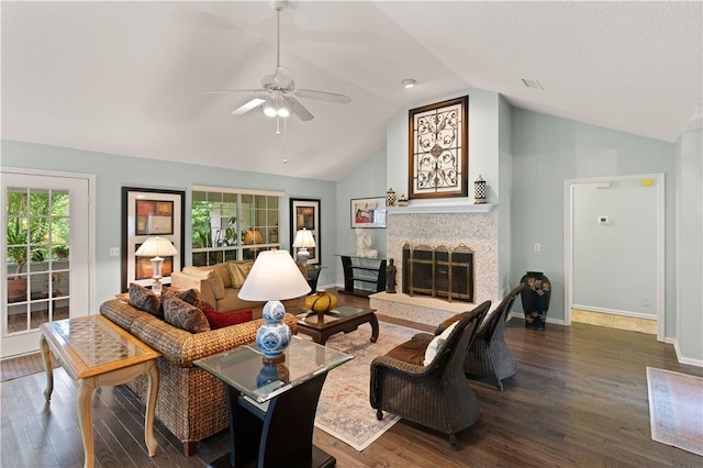 living room with dark hardwood / wood-style flooring, ceiling fan, and lofted ceiling