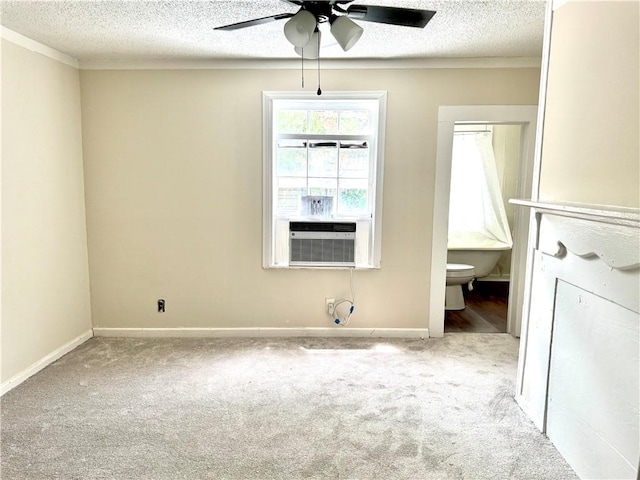 1108 George St, Brunswick, GA 31520 - unfurnished bedroom featuring cooling unit, carpet flooring, a textured ceiling, ensuite bathroom, and a ceiling fan