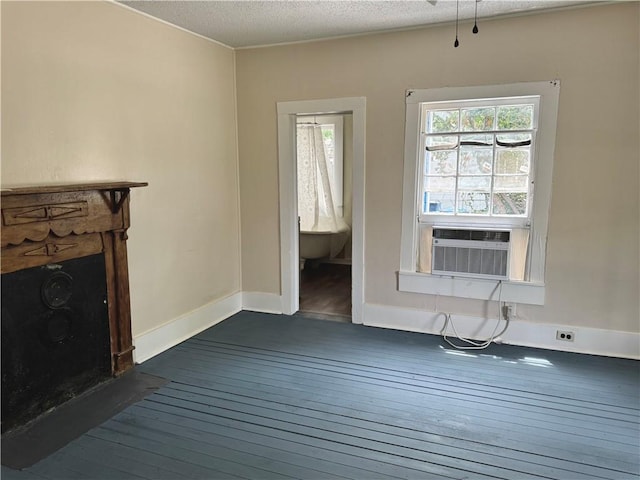 1108 George St, Brunswick, GA 31520 - unfurnished living room featuring dark wood-style flooring, a fireplace, a textured ceiling, and cooling unit