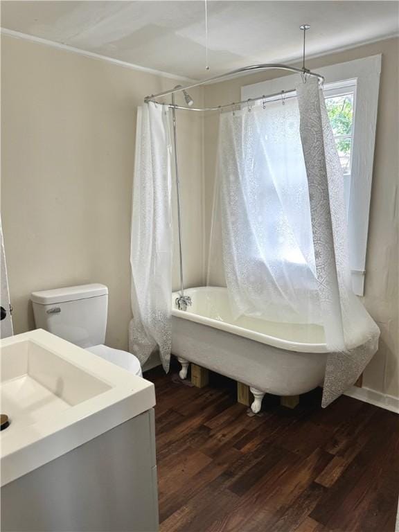 1108 George St, Brunswick, GA 31520 - bathroom featuring wood finished floors, shower / bath combo with shower curtain, and vanity