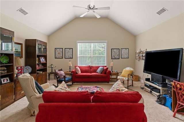 living room featuring lofted ceiling, ceiling fan, and light carpet