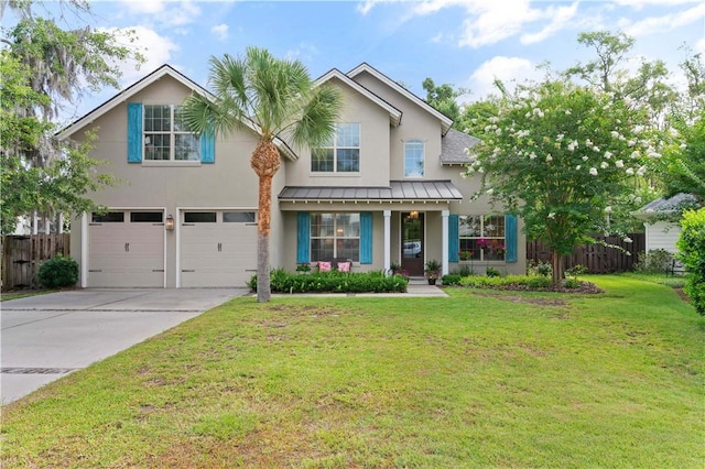 view of front of property with a front yard, a garage, and covered porch