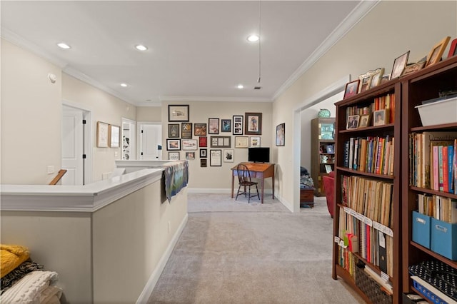 interior space with a kitchen island, light carpet, and crown molding