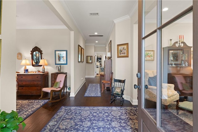 hall with dark hardwood / wood-style flooring and crown molding