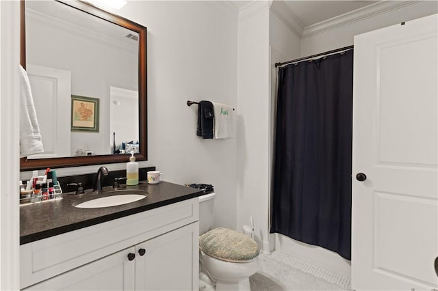 bathroom with toilet, crown molding, and vanity