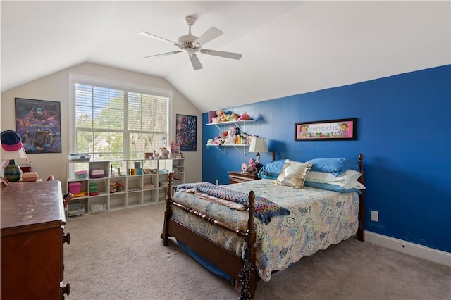 carpeted bedroom featuring ceiling fan and vaulted ceiling