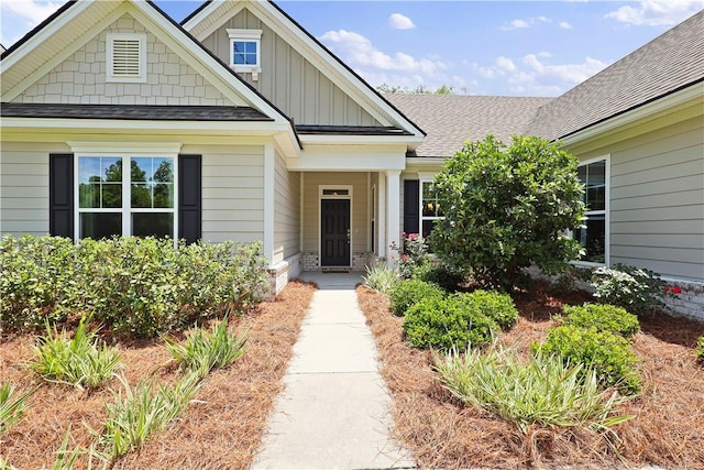 138 Clearwater Dr, Brunswick, GA 31523 - entrance to property with a shingled roof and board and batten siding