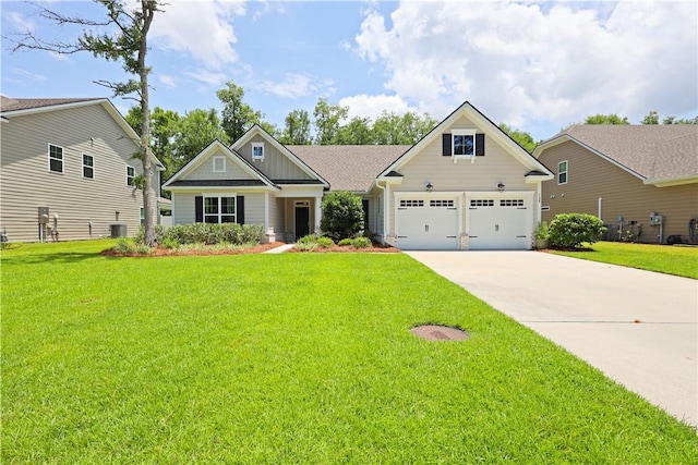 138 Clearwater Dr, Brunswick, GA 31523 - craftsman-style home featuring driveway, board and batten siding, a front lawn, a garage, and central AC