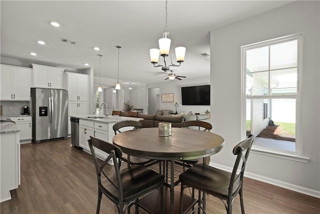 138 Clearwater Dr, Brunswick, GA 31523 - dining area featuring a chandelier, dark wood finished floors, baseboards, and recessed lighting