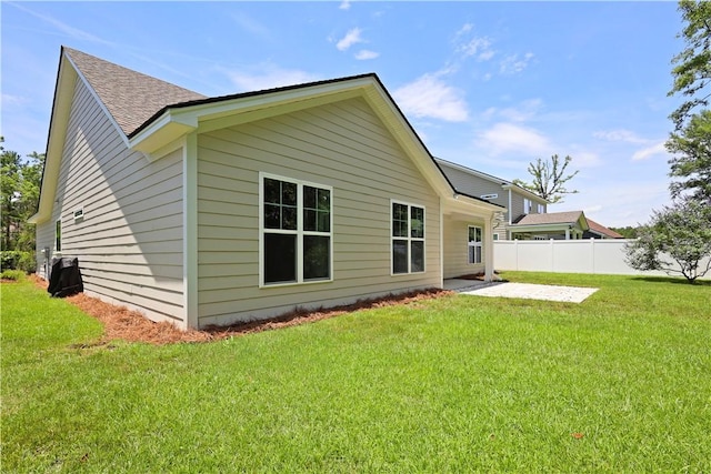 138 Clearwater Dr, Brunswick, GA 31523 - back of property featuring a patio and a shingled roof