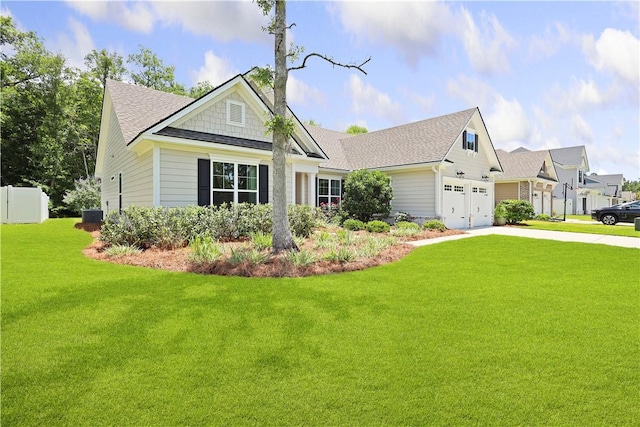 138 Clearwater Dr, Brunswick, GA 31523 - craftsman-style home featuring driveway, a garage, roof with shingles, and central AC unit