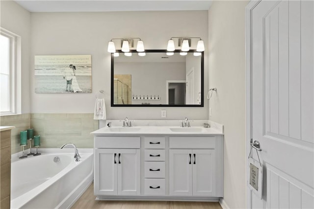 138 Clearwater Dr, Brunswick, GA 31523 - full bath with double vanity, a bath, plenty of natural light, and a shower with shower door
