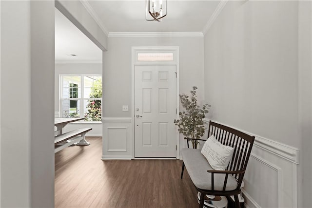 138 Clearwater Dr, Brunswick, GA 31523 - entrance foyer featuring dark wood-style flooring, crown molding, and wainscoting