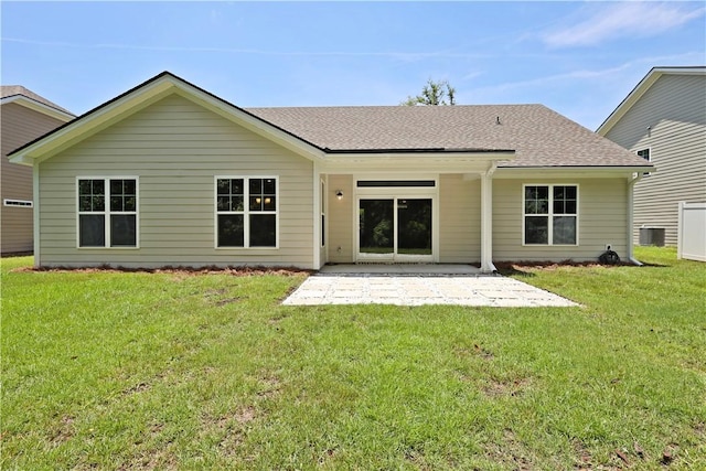 138 Clearwater Dr, Brunswick, GA 31523 - rear view of property with a patio area, a yard, roof with shingles, and central AC