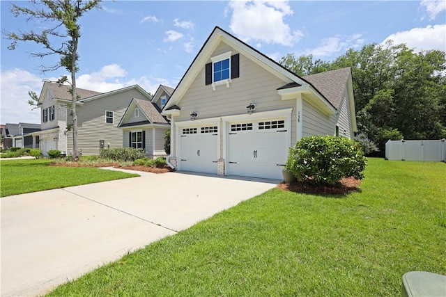 138 Clearwater Dr, Brunswick, GA 31523 - view of property exterior with driveway and a lawn