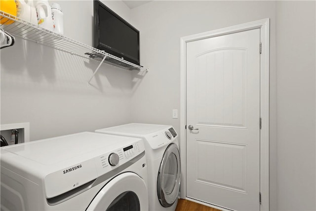 138 Clearwater Dr, Brunswick, GA 31523 - washroom featuring washer and dryer and wood finished floors