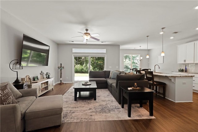138 Clearwater Dr, Brunswick, GA 31523 - living area featuring recessed lighting, a ceiling fan, dark wood-style floors, and baseboards