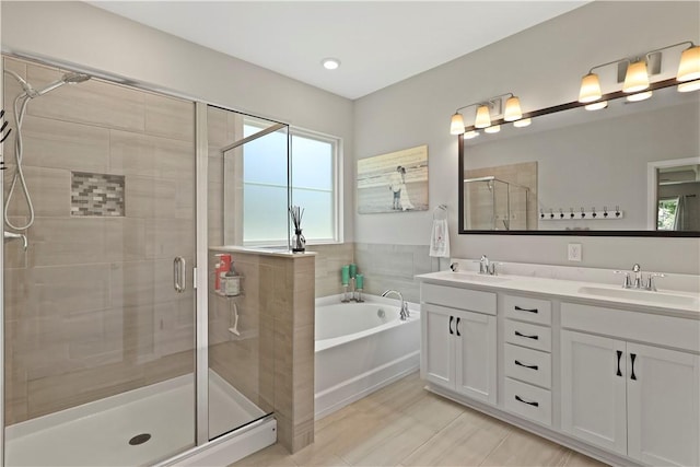 138 Clearwater Dr, Brunswick, GA 31523 - full bath with a shower stall, a bath, double vanity, and healthy amount of natural light